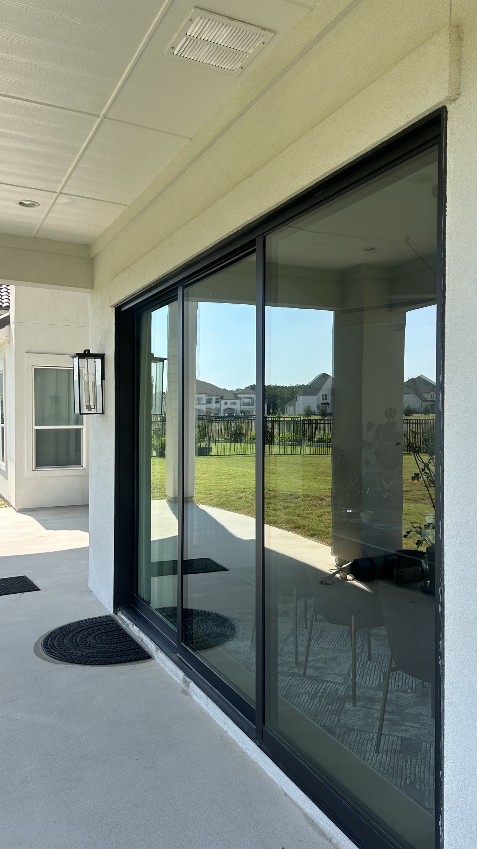 Spotless, streak-free sliding glass patio door cleaned by GlowGrids